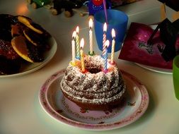 birthday cake with burning candles