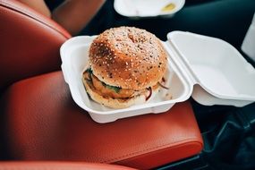 deliciously looking burger in car for lunch