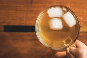 mug of iced tea in hand