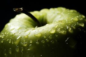 water droplets on a sour green apple