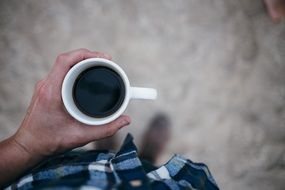 black coffee in male hands