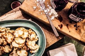 cheese with crackers on a cutting board