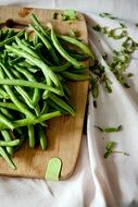 green beans on a wooden board