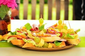 beautifully sliced fruits on a plate