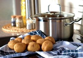 clean potatoes near the pan