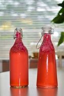 red bottles with fruit juice