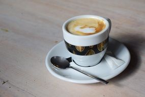 coffee in white cup with spoon