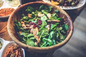 green salad in a wooden bowl