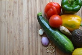 pepper, tomato, onion, zucchini on the table