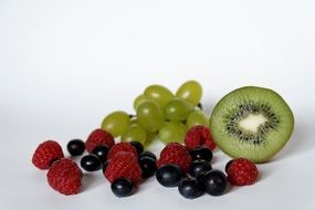 blueberries and raspberries and grapes kiwi