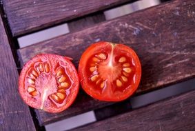 a small tomato is cut into two parts