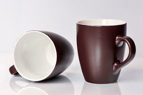two brown mugs