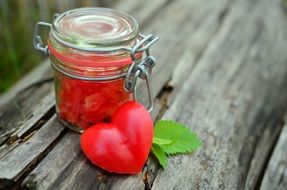 jar with red pepper and heart