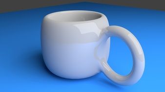 white and brown cup with the big handle on a blue table