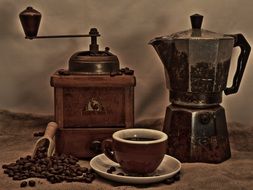 coffee grinder, coffee maker and cup of coffee