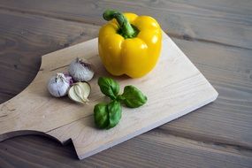 Yellow paprika and garlics and basil