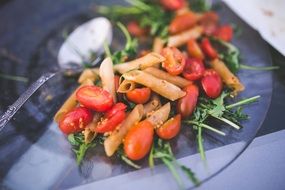 Pasta with rucola,tomatoes and souce