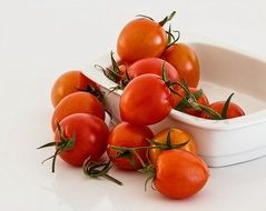 red cherry tomatoes in a white container