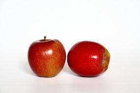 two red apples on white background