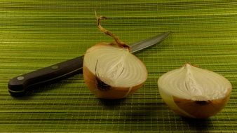 onion cut in half by a knife