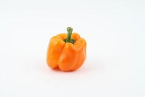 orange paprika vegetable on white