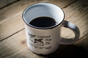 metal cup with coffee