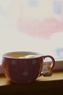 morning tea in a cup with polka dots