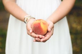 peach in hands