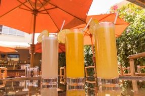 variety of juices in glasses in a summer cafe