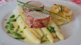 restaurant dish with fillet, asparagus and potatoes