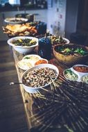 table with salads and snacks