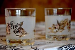 ornamented glasses on table