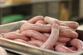 sausages on a metal tray