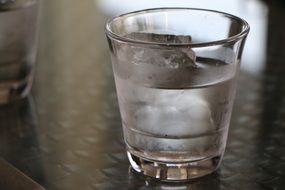 glass of water with ice cube