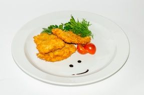 fried chicken chops on a white plate