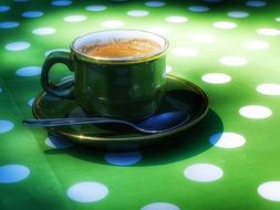 cup of coffee on a saucer on a table