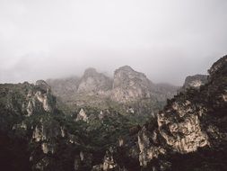 fog over a massive mountain range