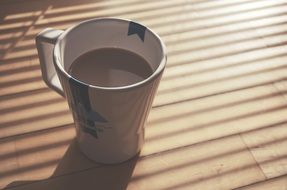 morning mug of coffee under the light