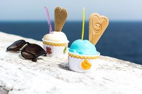 ice cream on a table near the sea