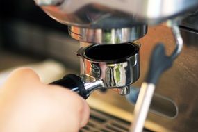 man is making cappuccino coffee