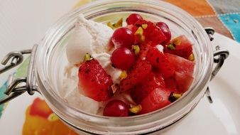 meringues with berries in a glass bowl