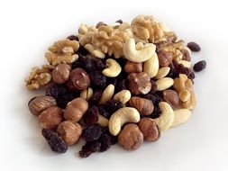 different types of nuts are in a pile