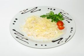 useful coleslaw on a white plate decorated with sauce