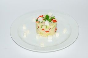 beautifully decorated salad dish on a white plate