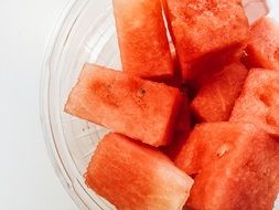 sliced watermelon in a transparent bowl