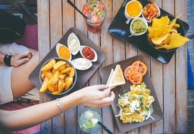 Woman eating dinner in restaurant