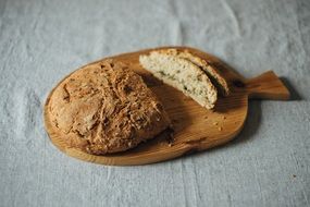 bread loaf on wooden board