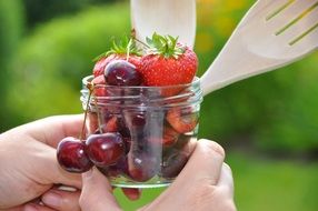fresh berries in a transparent jar