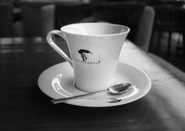 cup of coffee on a saucer with a spoon