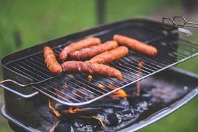 sausages on a grill